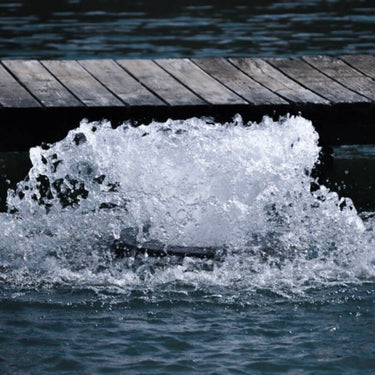 Bearon Aquatics Power House Surface Aerator On The Water Bubbling In Front Of A Pier